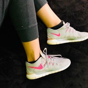 Gray and pink nike free 5.0